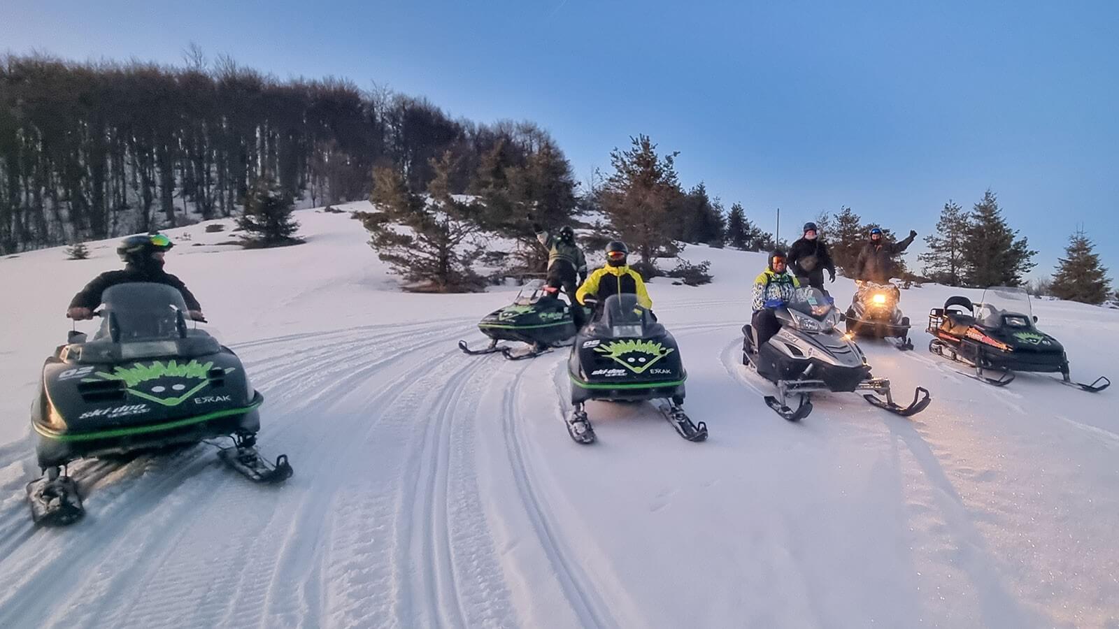 Snowmobile ride through snowy forest at Petrohan near Sofia