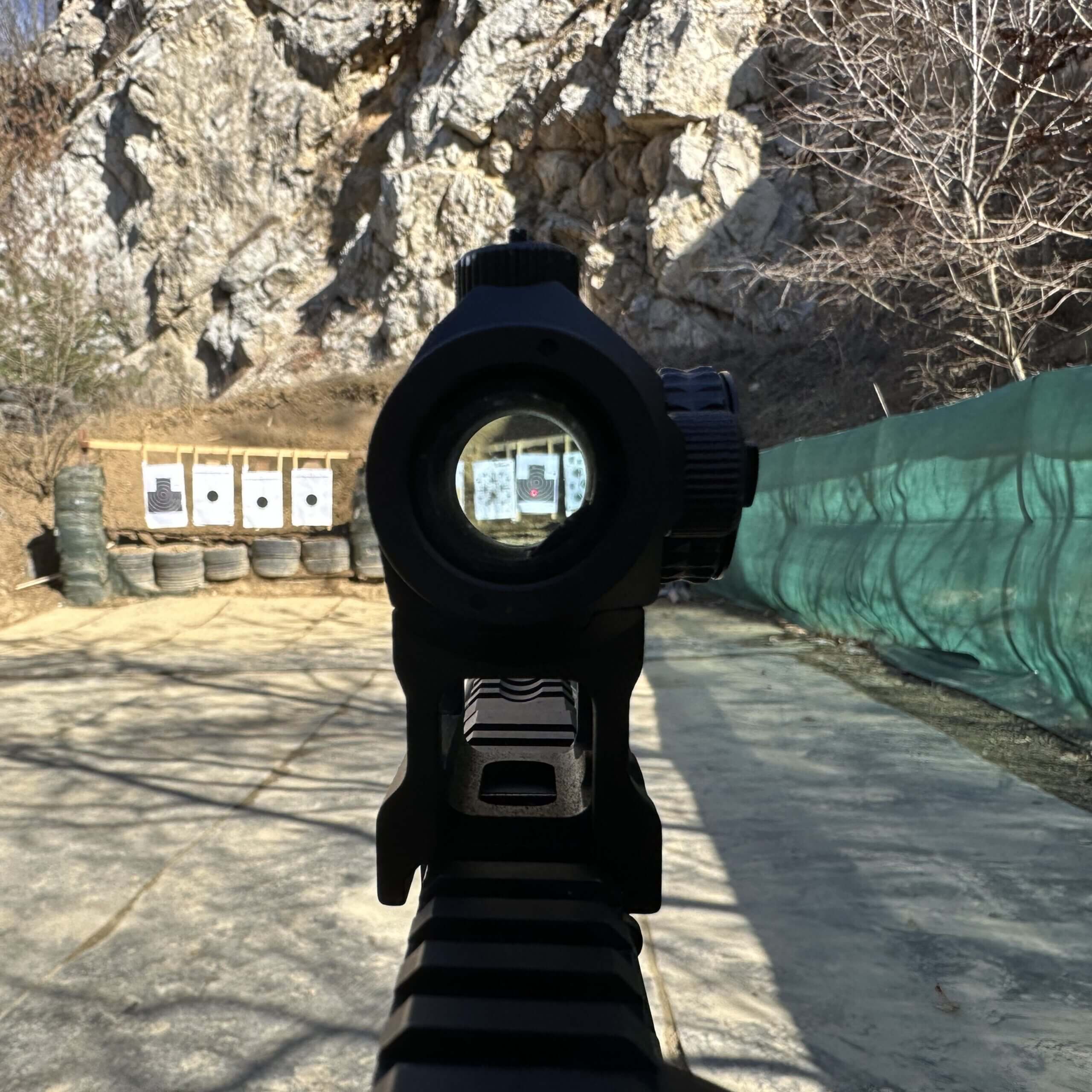 Instructor with a shooter on the firing line