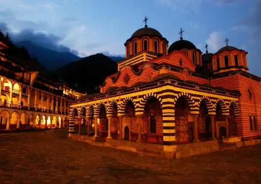 Rila Monastery church lit up in the evening