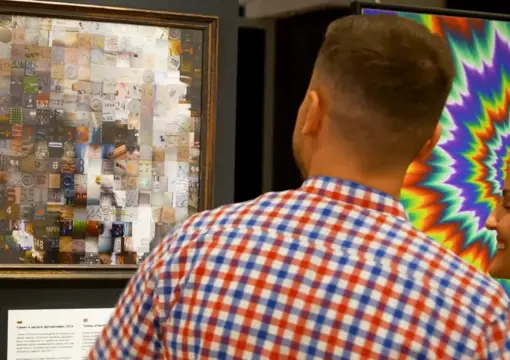 Visitor looking at a hidden portrait illusion