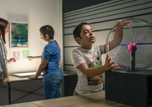 Children trying an interactive exhibit