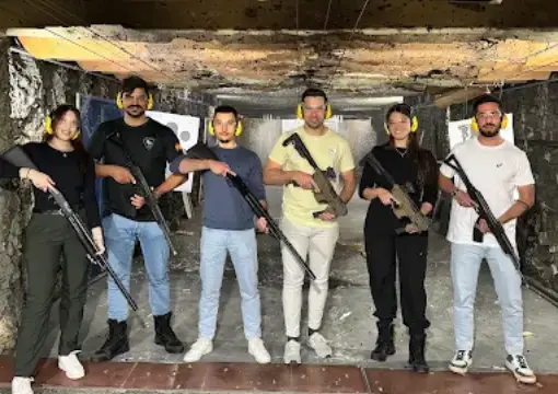 Group of friends with rifles at the indoor shooting range in Sofia