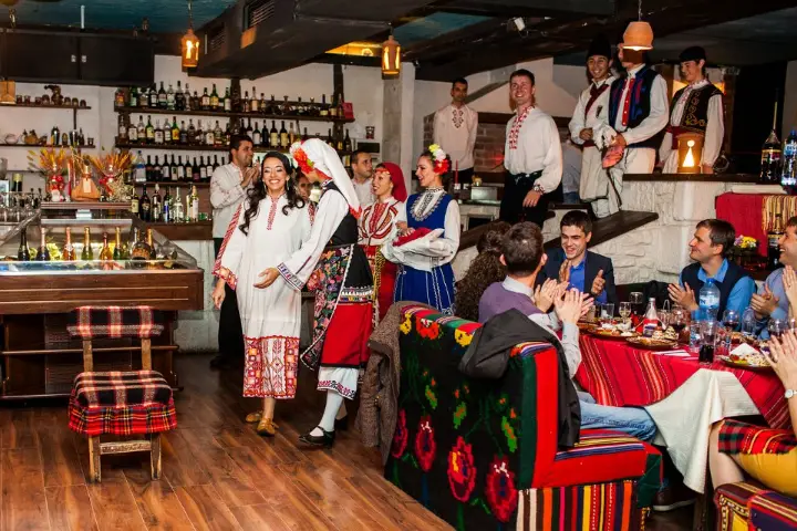 Performers in costume among the guests