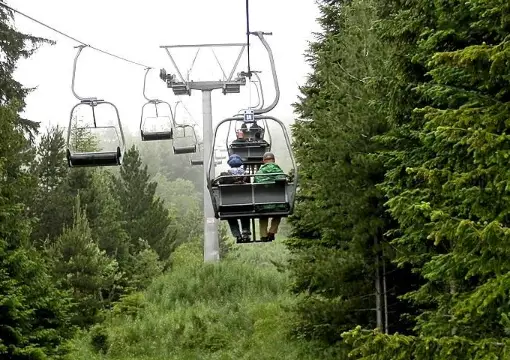 Chairlift to the Seven Rila Lakes between spruce trees