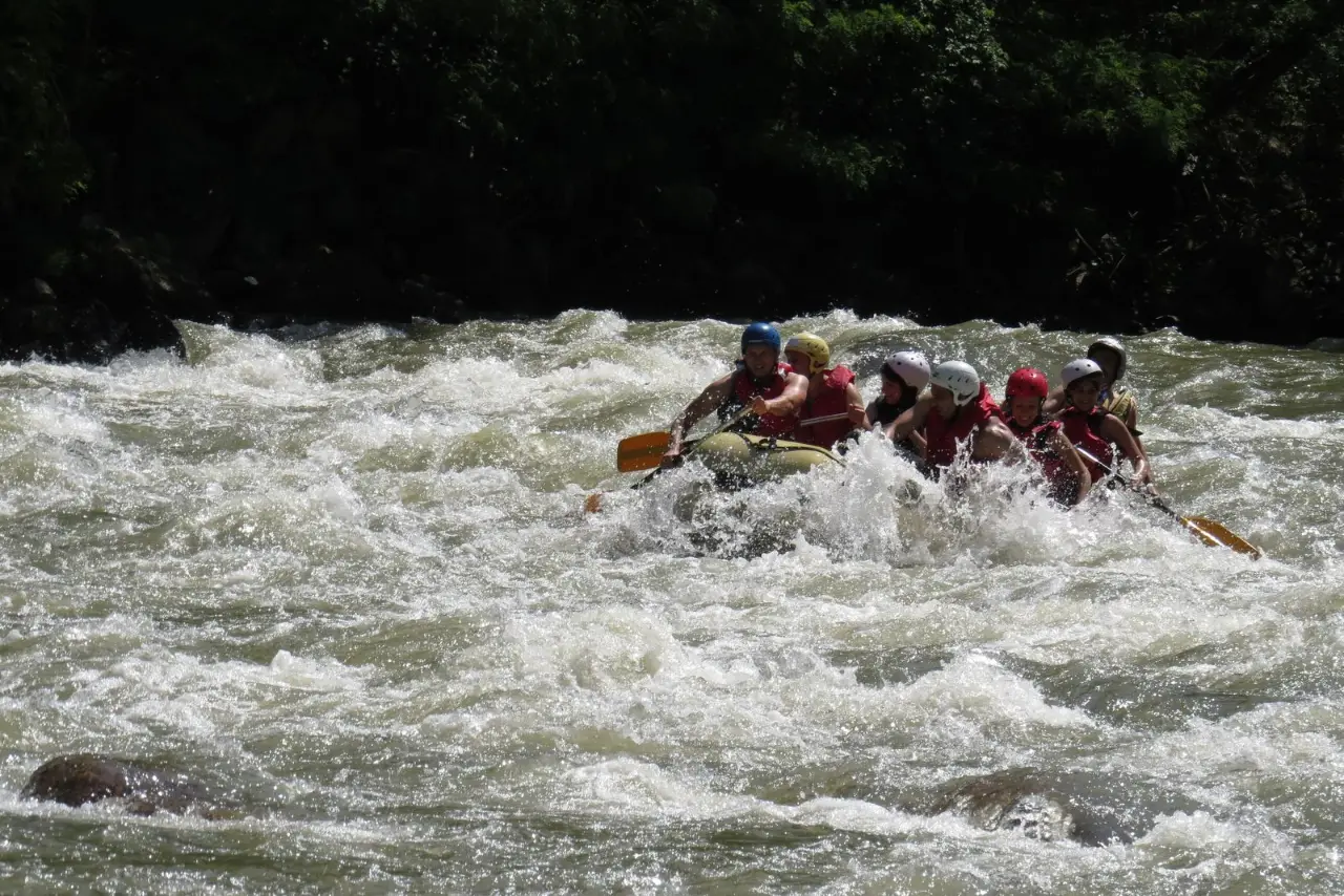 Raft crossing a wide rapid in the gorge