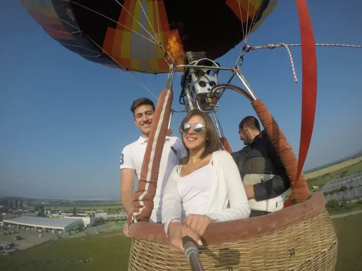 Friends taking a selfie in the balloon basket