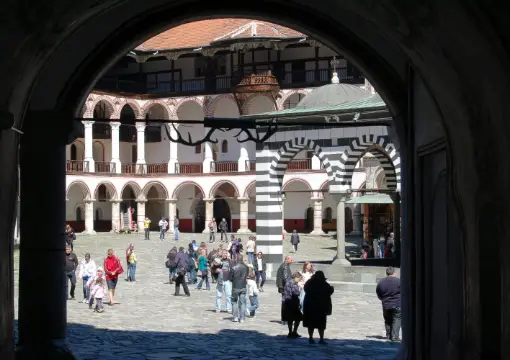 Rila Monastery courtyard seen through an arch