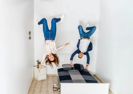 Children who seem to stand on the ceiling in the upside-down room