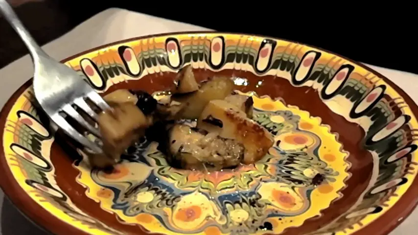 A traditional dish on a hand-painted plate