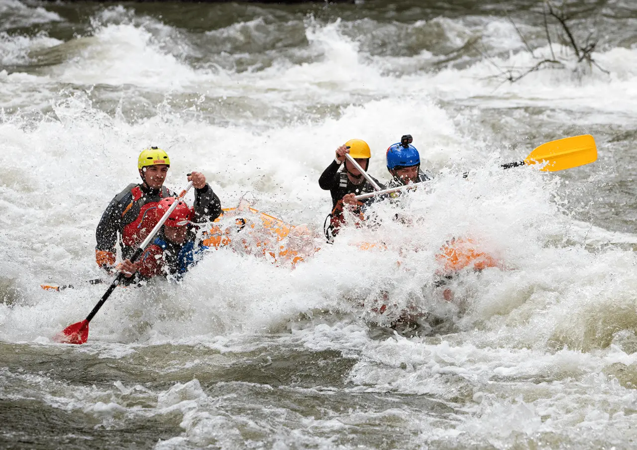 Rafters paddling through a rapid on the Struma
