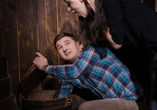 Player finding a hidden clue in a wooden barrel