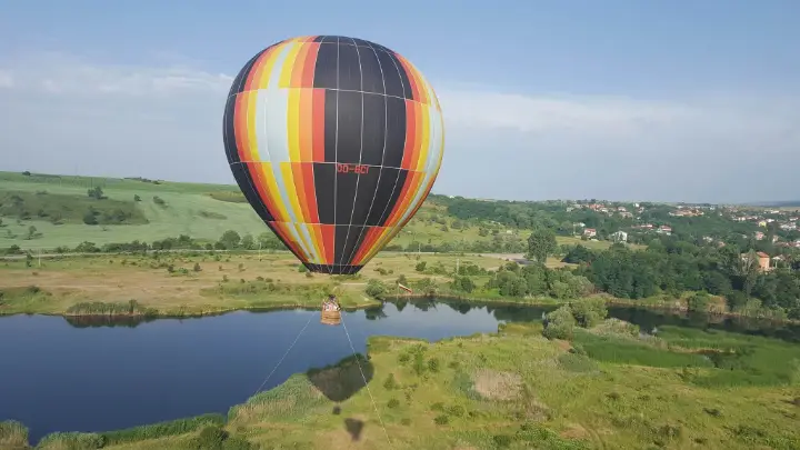 Balloon flying over a lake near Sofia