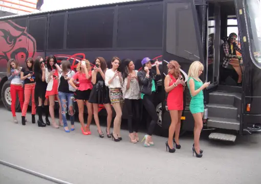 Group of friends posing next to the party bus in Sofia