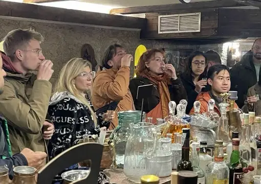 Guests listening to a guide at the Rakia Museum tasting bar