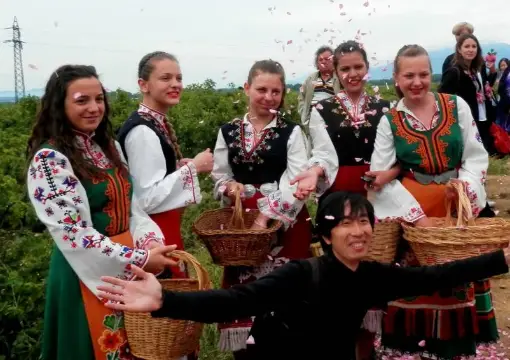 Rose pickers in traditional costume during the rose harvest