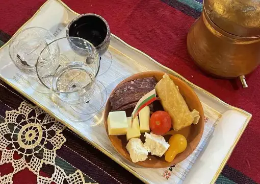 Rakia tasting set with cheese, sausage and fruit