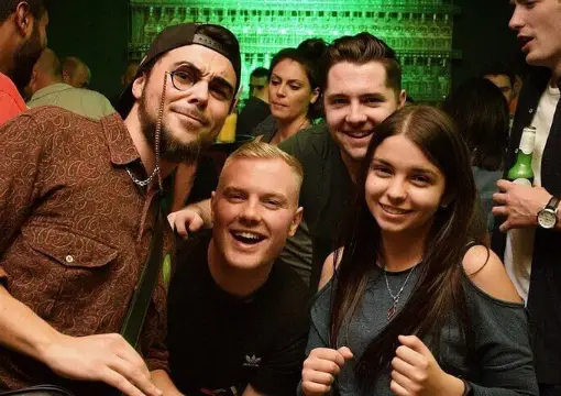 Friends smiling together at a bar in central Sofia