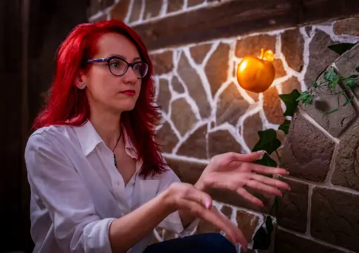 Player reaching for the golden apple by a stone wall