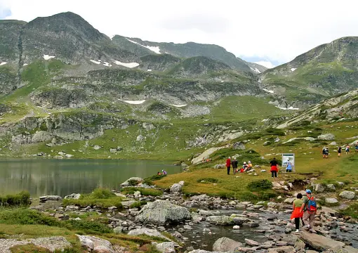 Hikers walking between the lakes in the Rila cirque