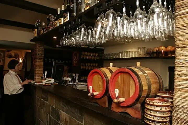 The bar with wooden barrels