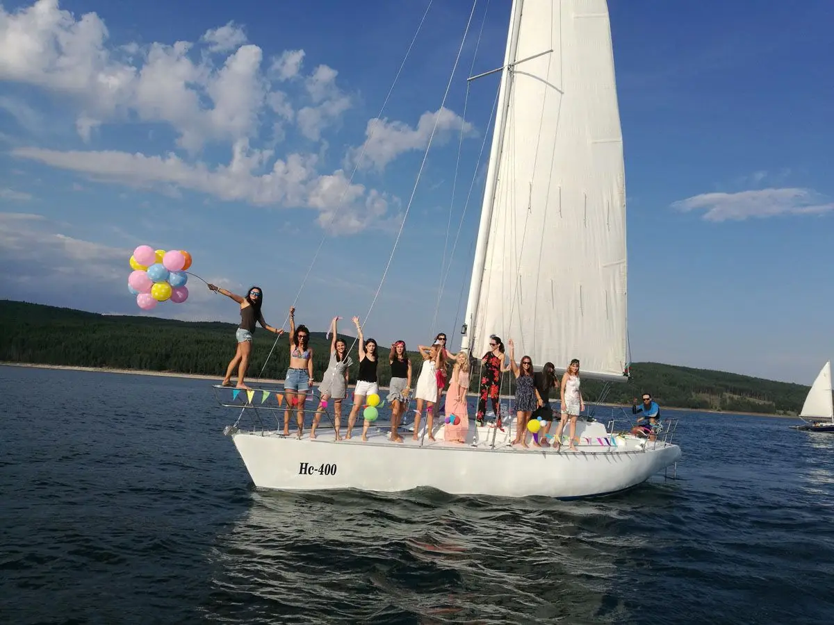 Hen party with balloons on a white sailing yacht