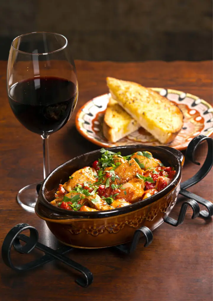 A Bulgarian stew with bread and red wine