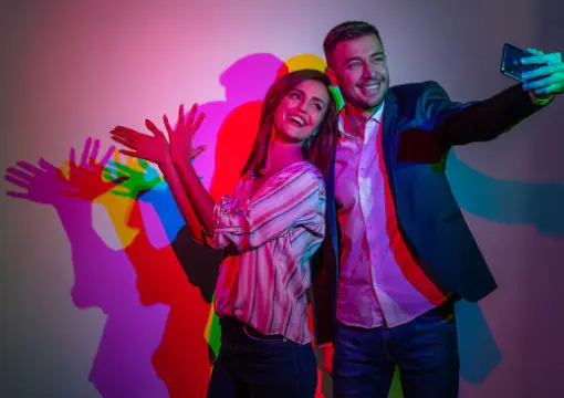 Colourful shadows on the wall in the light room