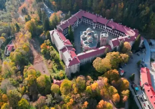 Rila Monastery from the air, surrounded by autumn forest
