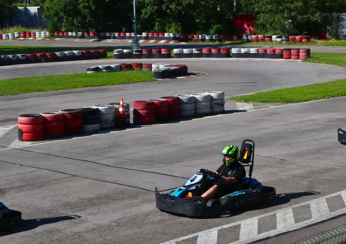 Kart on a wide corner of the outdoor circuit