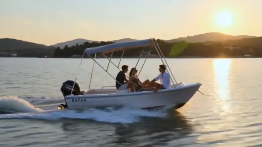 Friends on a motorboat with the sun low over the hills