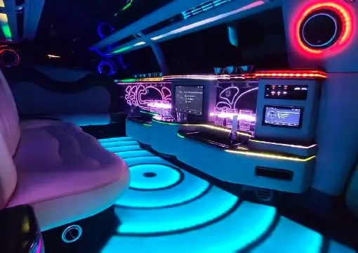 Party limo interior with blue LED floor and bar