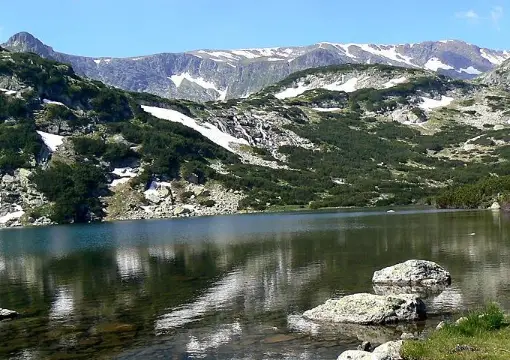 Rocks and mountain reflections in a Rila lake