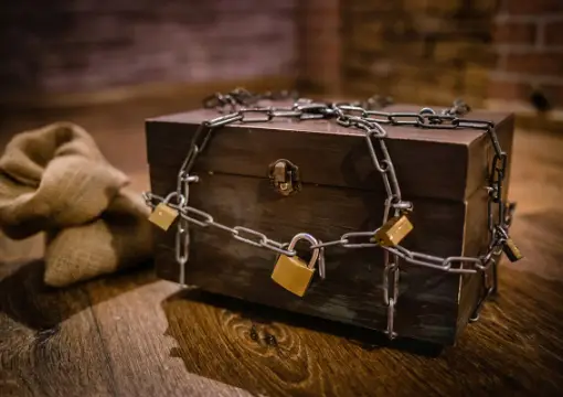Locked treasure box wrapped in chains