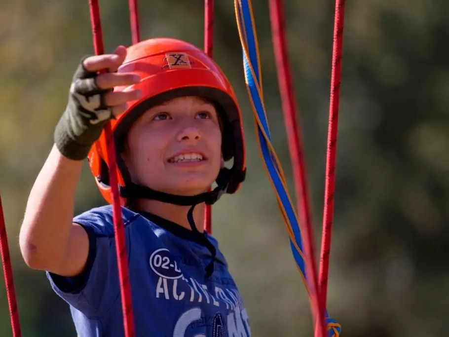 Climbing a rope element in the rope garden