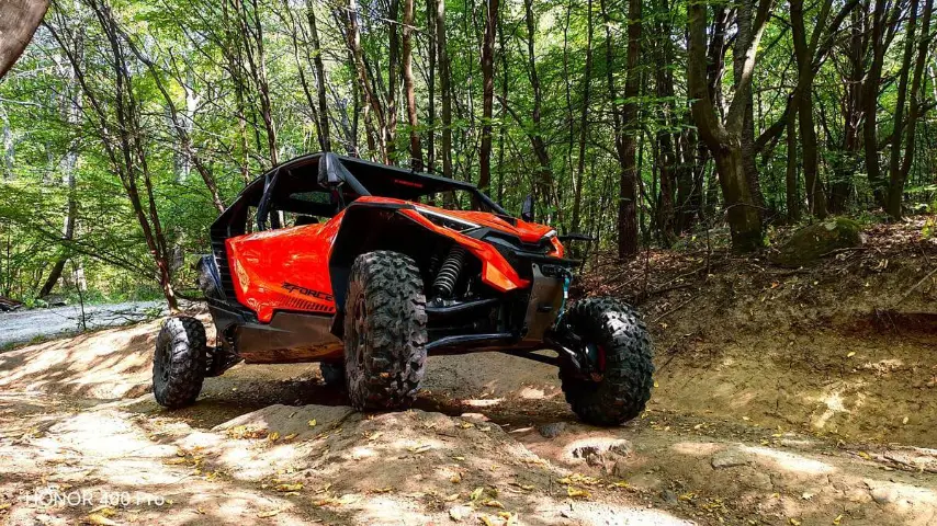 UTV buggy on a muddy mountain track