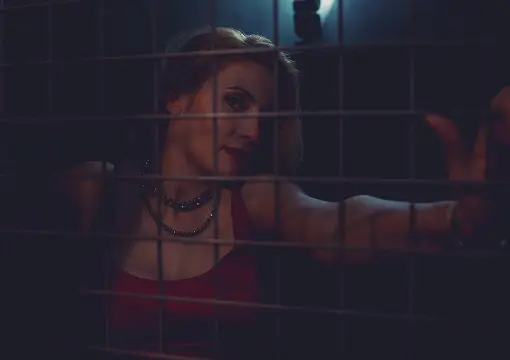 Player behind a lit grid in the dark Matrix room