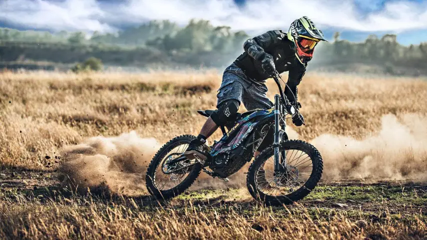 Electric off-road motorbike on a forest track