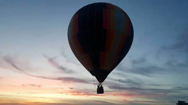 Hot air balloon at sunrise before a bungee jump