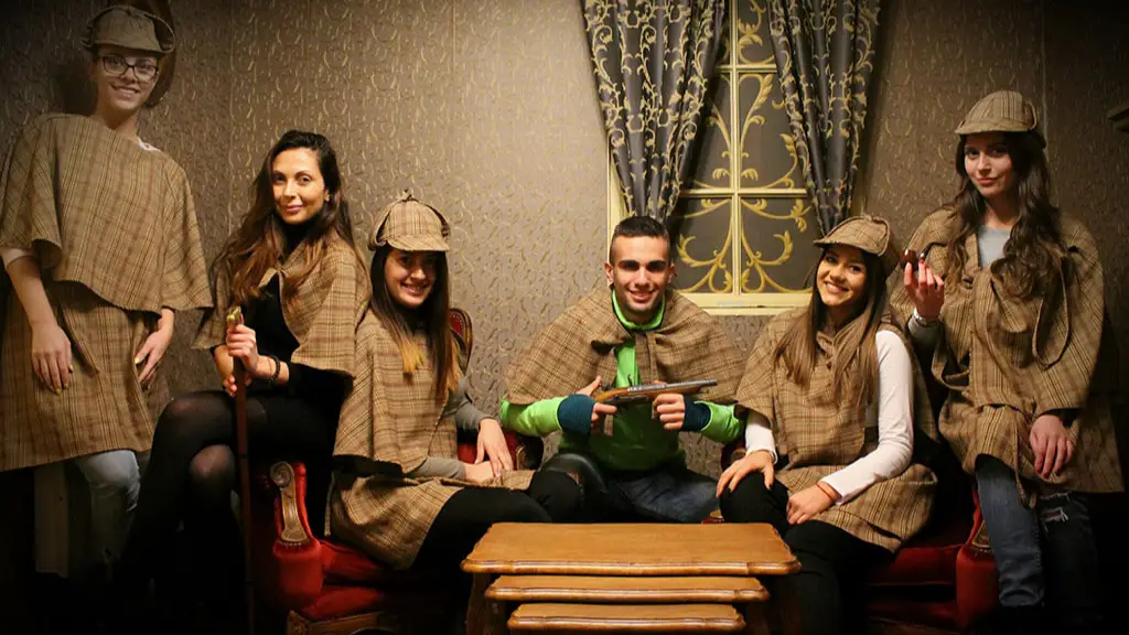 Team in detective hats inside the Sherlock Holmes escape room in Sofia