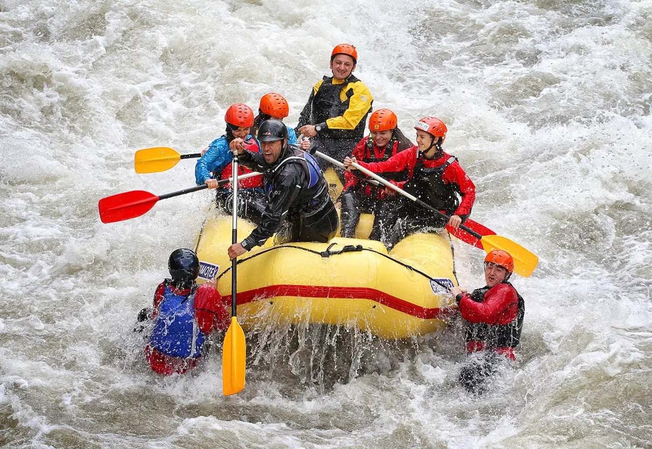 Yellow raft dropping into a big rapid in the Kresna Gorge
