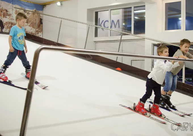Kids skiing on the indoor ski slope at CARVE Sofia