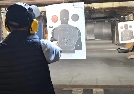 Pistol shooting at a paper target, indoor range Sofia